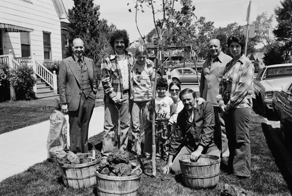 Congressman Frank Annunzio and his nephews plant a tree in front of home