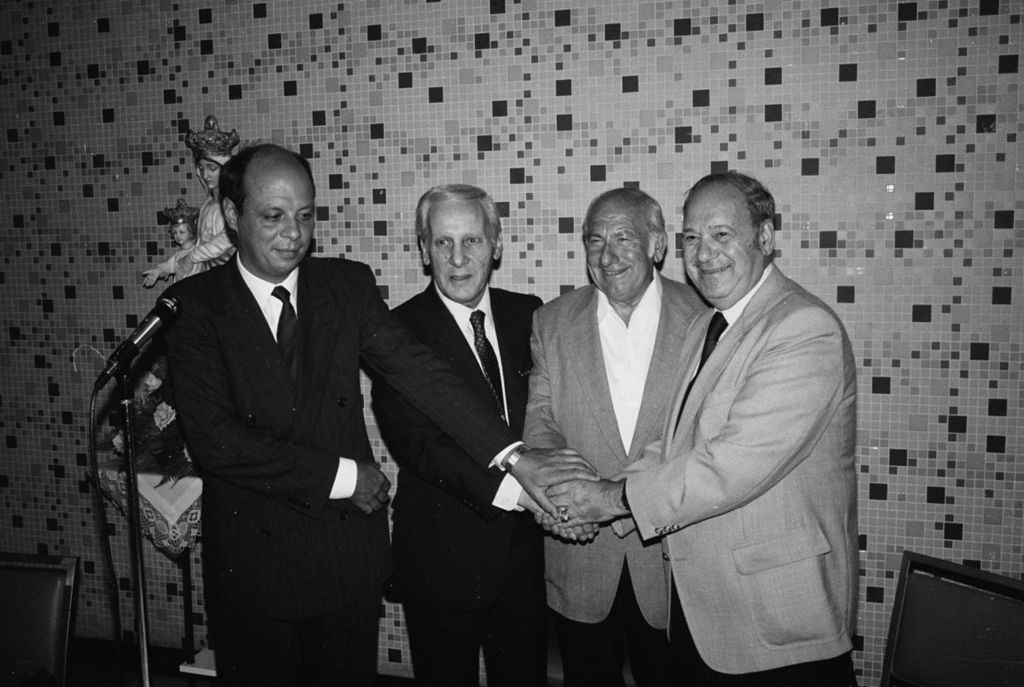 Miniature of Congressman Frank Annunzio shaking hands with three others
