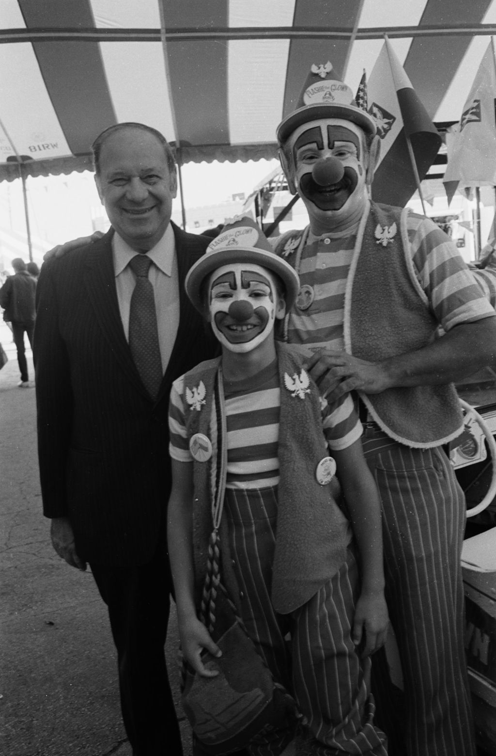 Congressman Frank Annunzio with Flashy the Clown and son