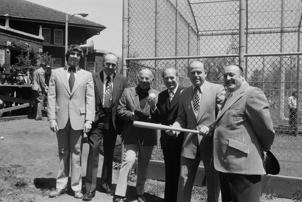 Congressman Frank Annunzio, Ed Kelly (with bat) at the opening of baseball season in Hamlin Park