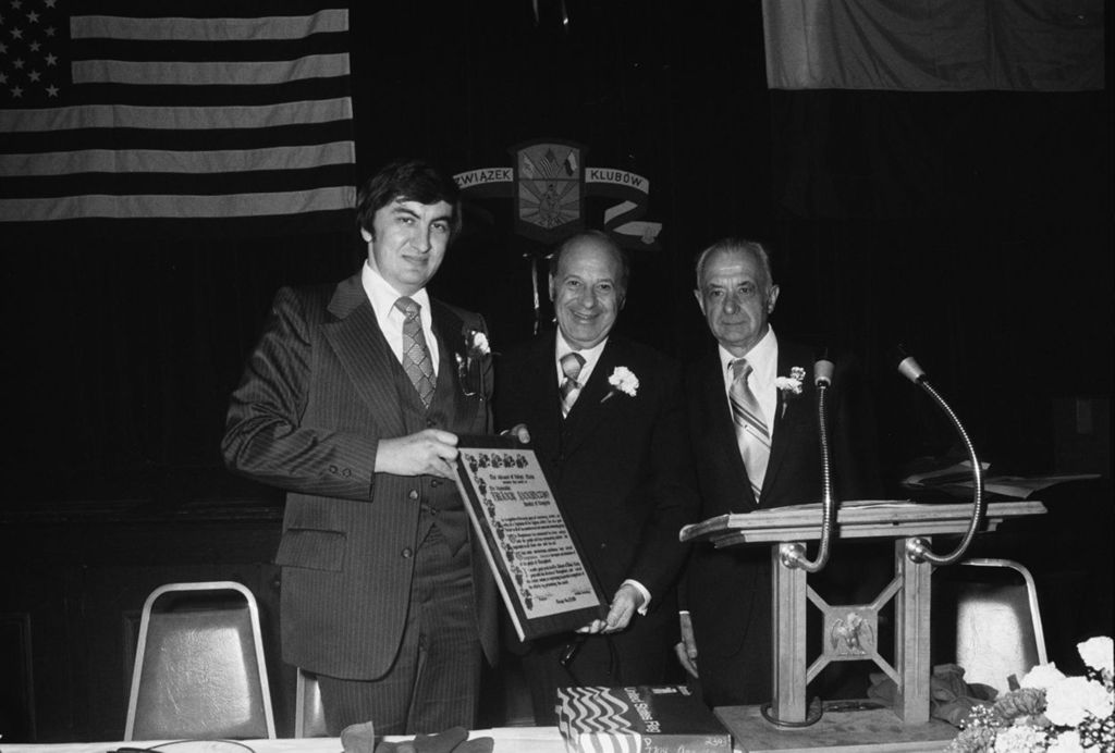 Miniature of Congressman Frank Annunzio receives award from George Migala at the Alliance of Polish Clubs