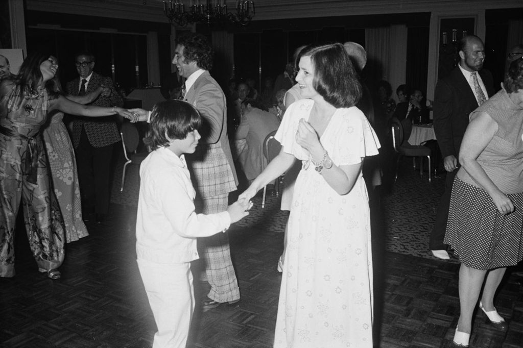 Miniature of Congressman Frank Annunzio's daughter Susan and grandson Mark dancing
