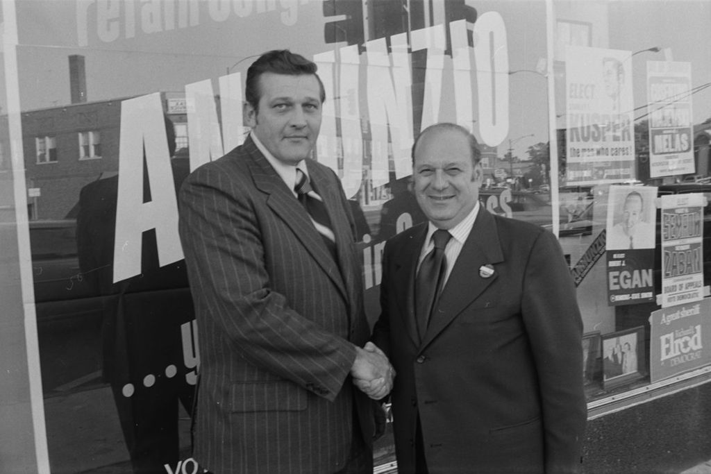 Miniature of Congressman Frank Annunzio with Committeeman Ted Lechowicz in front of Annunzio's campaign office