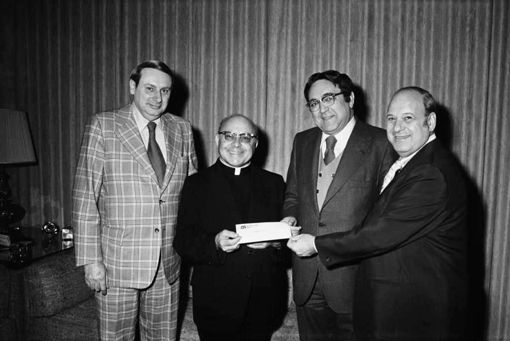 Miniature of Congressman Frank Annunzio and Father Armando Pierini collect donations for Villa Scalabrini