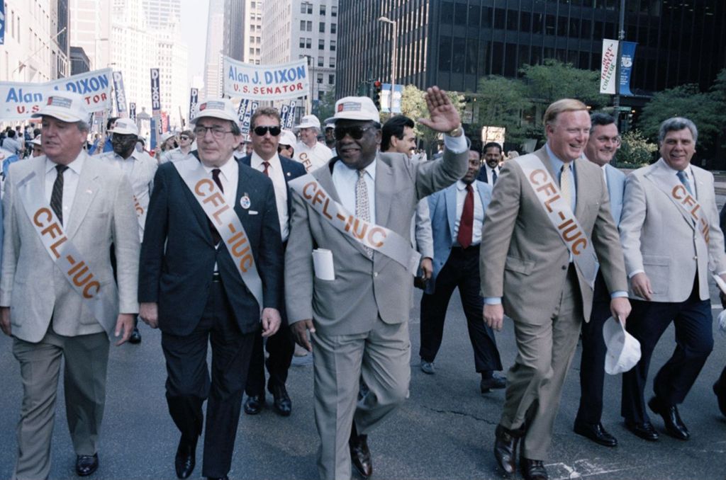Mayor Harold Washington marches in a Union Parade