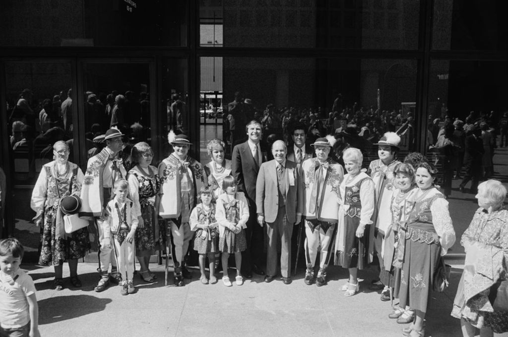 Miniature of Congressman Frank Annunzio with a group of parade marchers on Daley Plaza