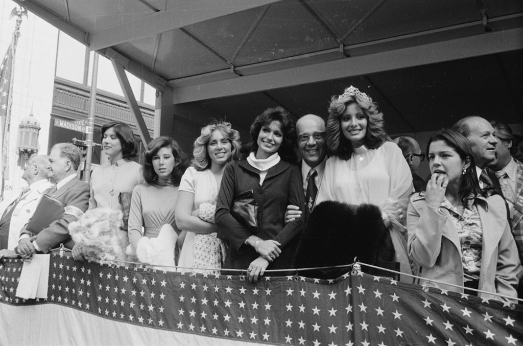 Miniature of Congressman Frank Annunzio, a Parade Queen and others stand on a parade reviewing stand