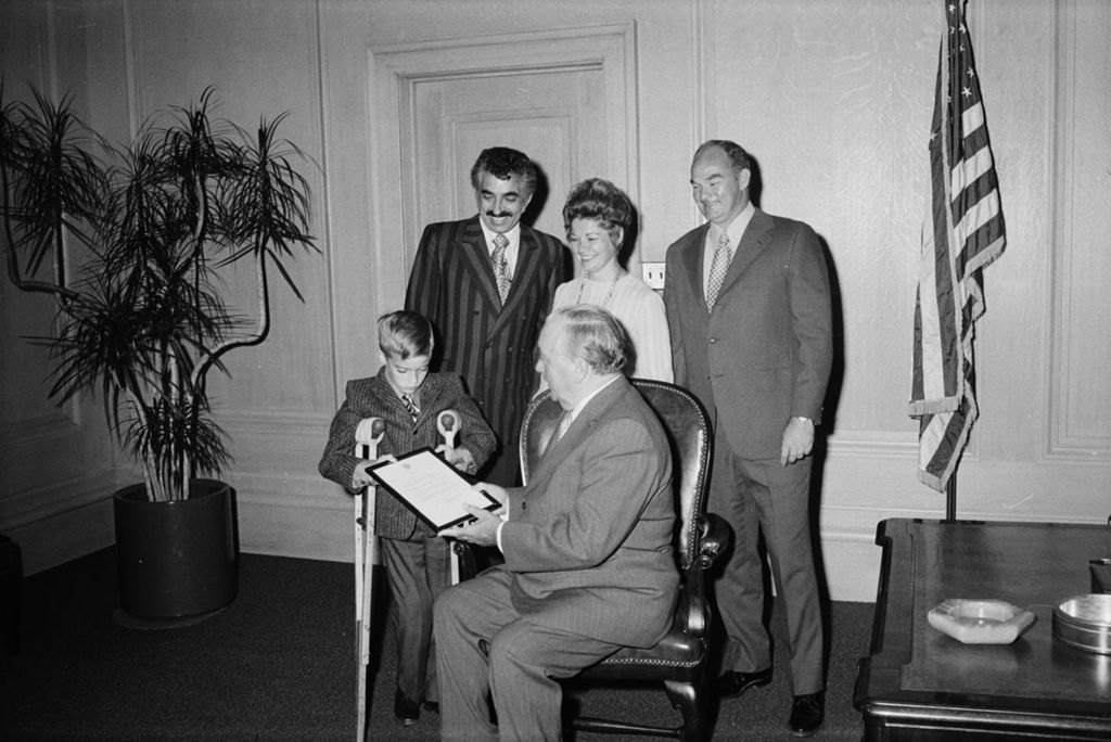 Mayor Richard J. Daley in an office with a Polio Fund survivor