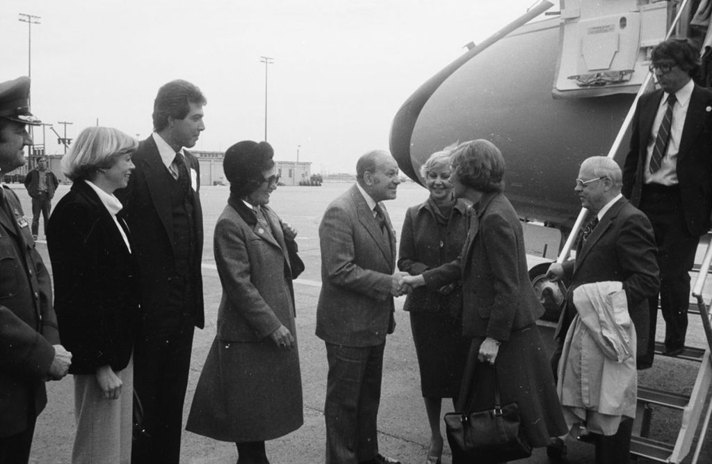 Congressman Frank Annunzio greeting Rosalynn Carter at Air Force One