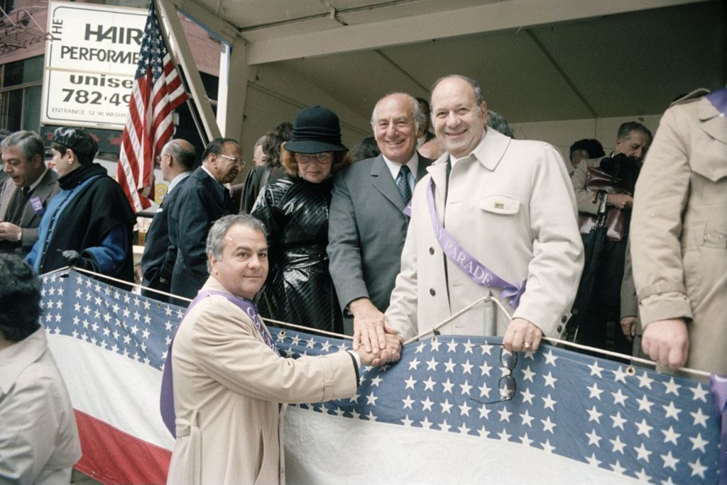 Congressman Frank Annunzio shaking hands at the Columbus Day Parade