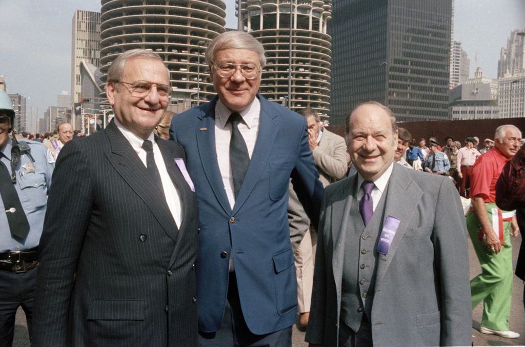 Lee Iacocca, Curt Prinz, and Congressman Frank Annunzio in front of Marina Towers