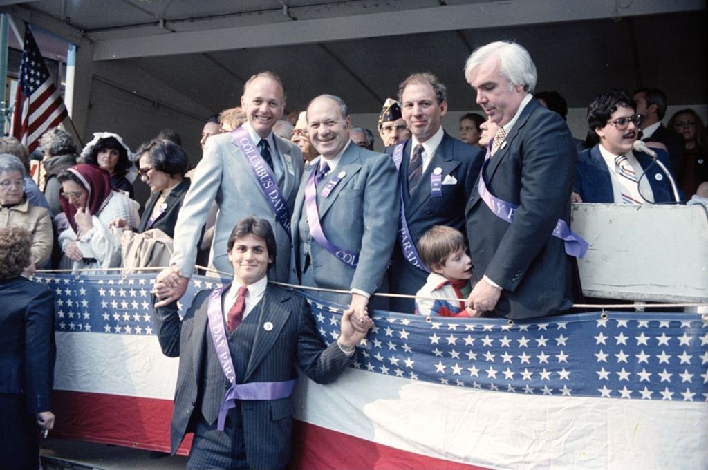 Congressman Frank Annunzio with others on the reviewing stand of the Columbus Day Parade