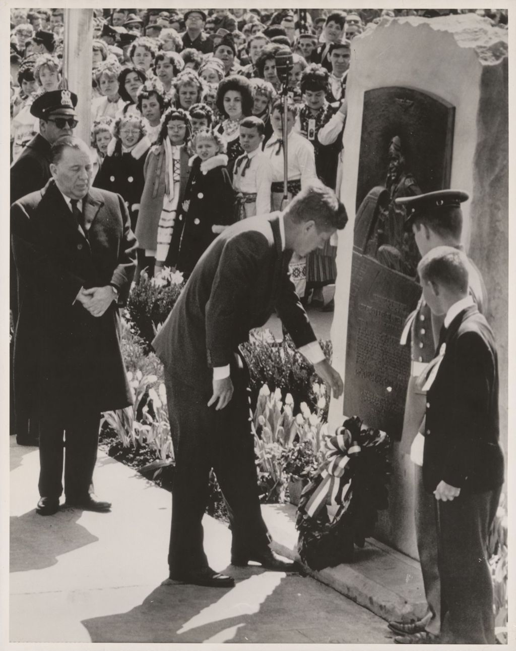 John F. Kennedy lays wreath at O'Hare monument