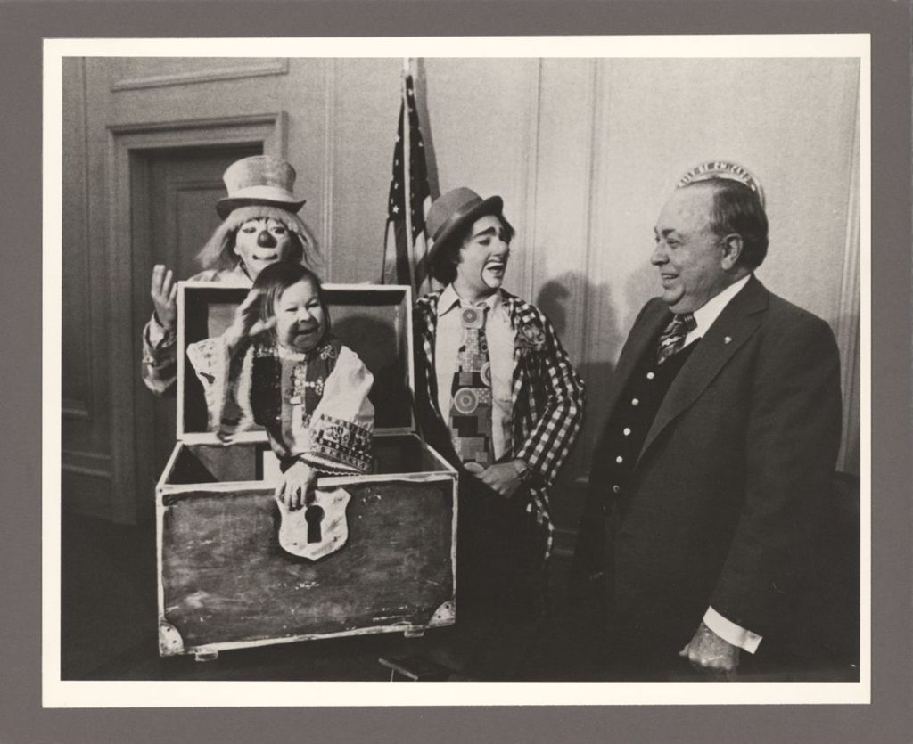Miniature of Richard J. Daley in his office with three clowns