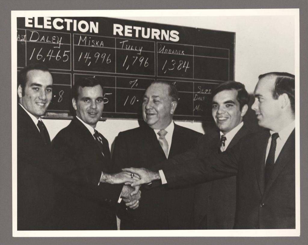 Miniature of Richard J. Daley and sons in front of elections return board