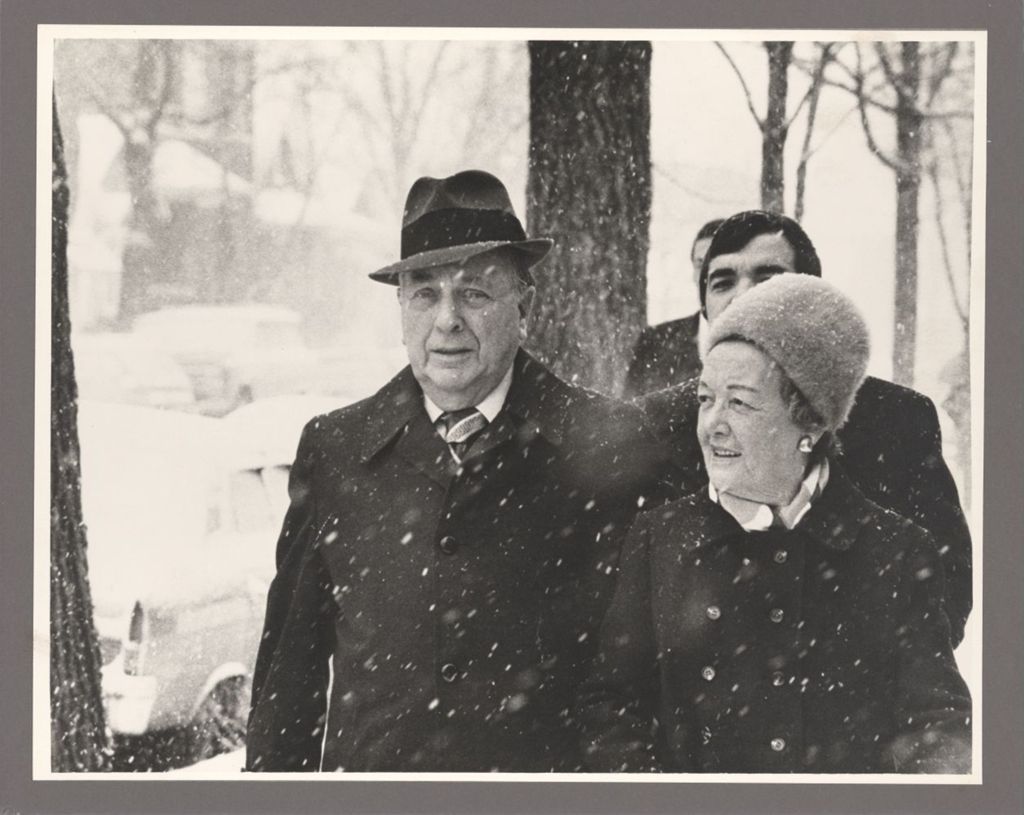 Eleanor and Richard J. Daley walking to polling place in the snow