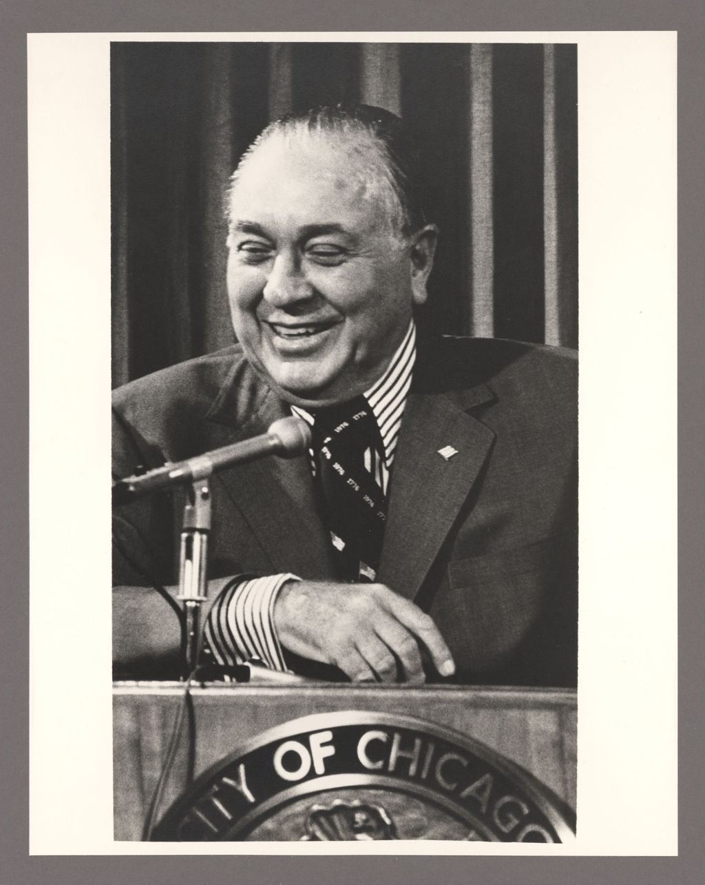 Miniature of Richard J. Daley at a podium, laughing