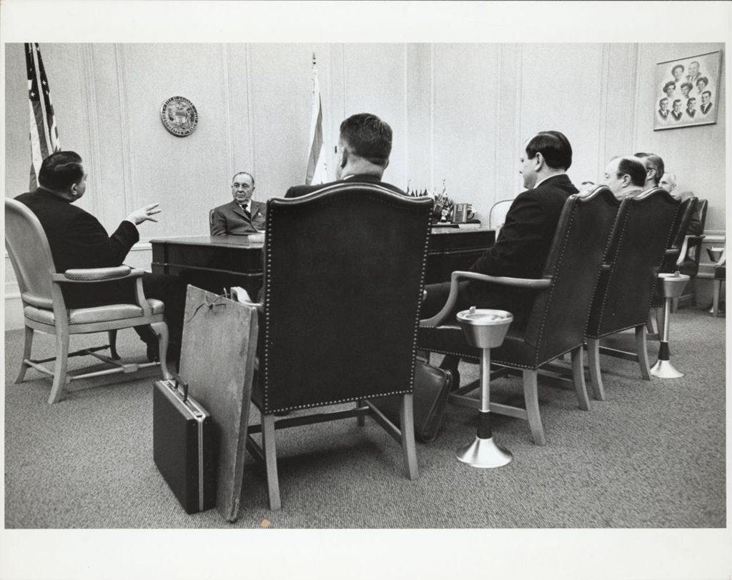 Miniature of Richard J. Daley at a meeting in his office