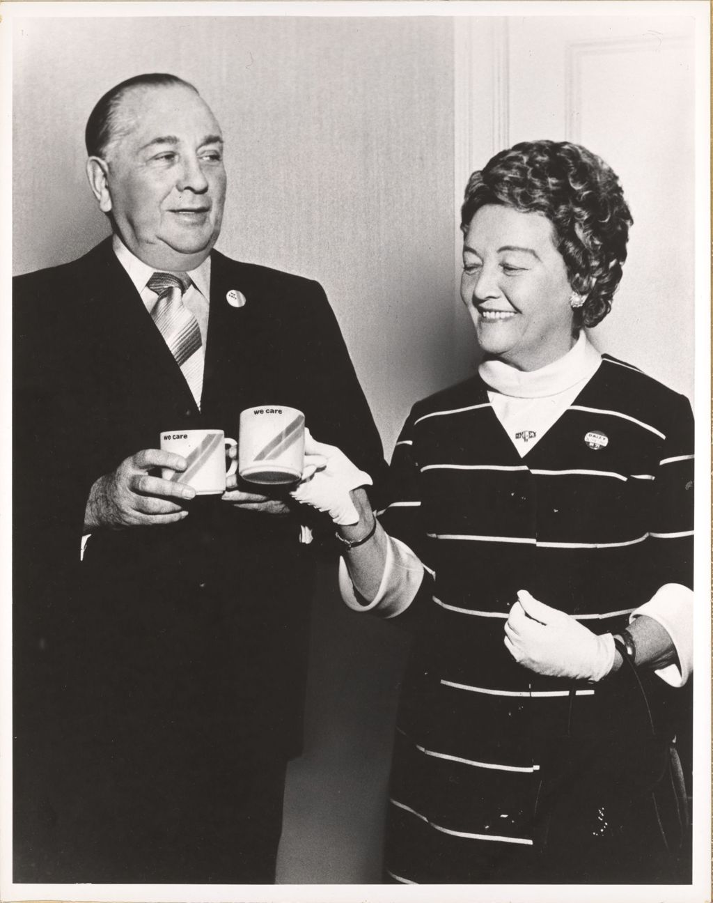 Miniature of Richard J. Daley and Eleanor Daley with "We Care" mugs