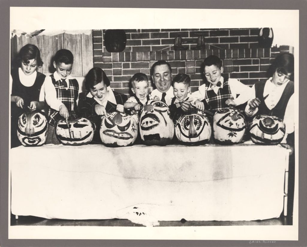 Richard J. Daley and his children decorating pumpkins