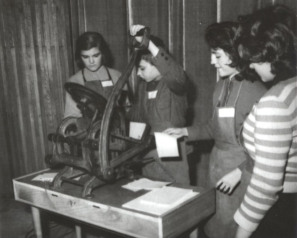 Girls working a printing press