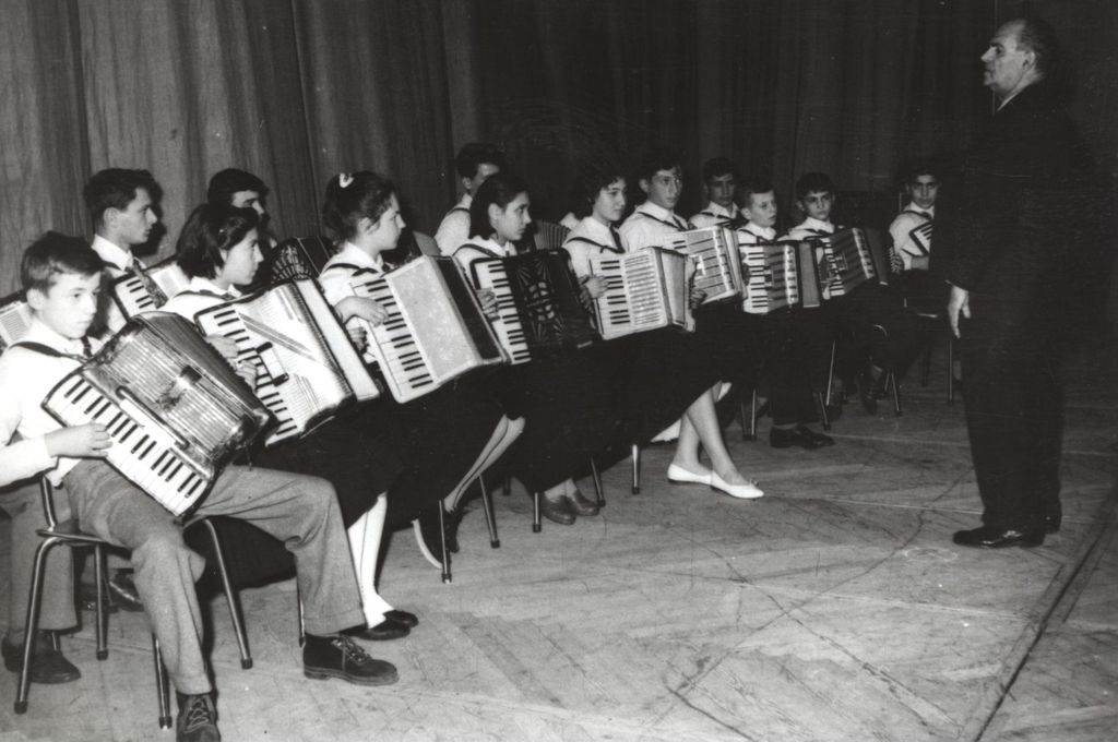Boys and girls playing accordions