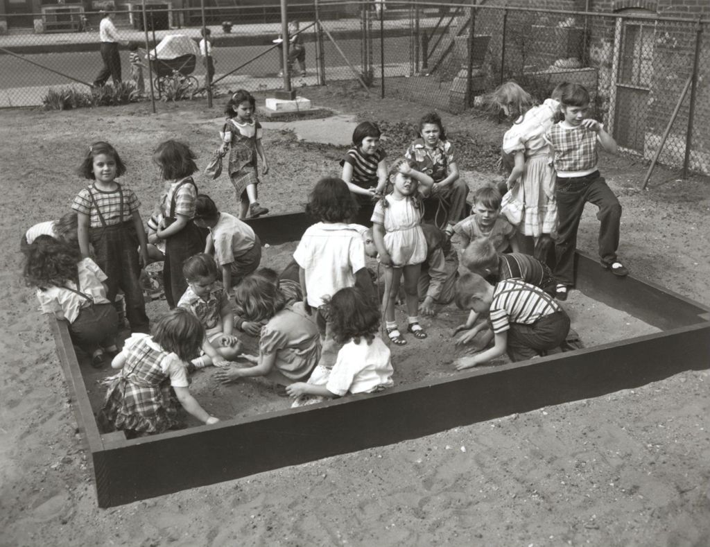 Children playing in sandbox, Southwest Community Council Playground #1