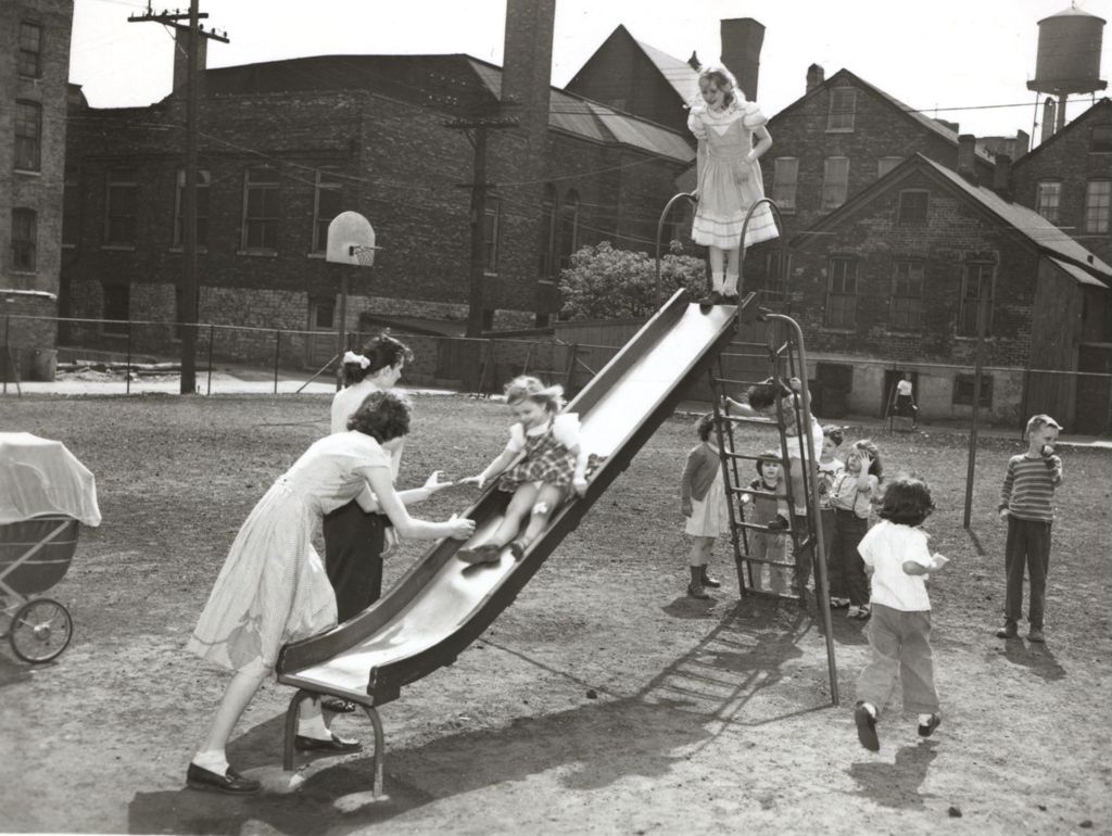 Children on a slide in playground