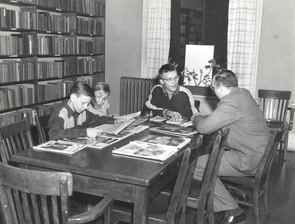 Reading newspapers and magazines in a library