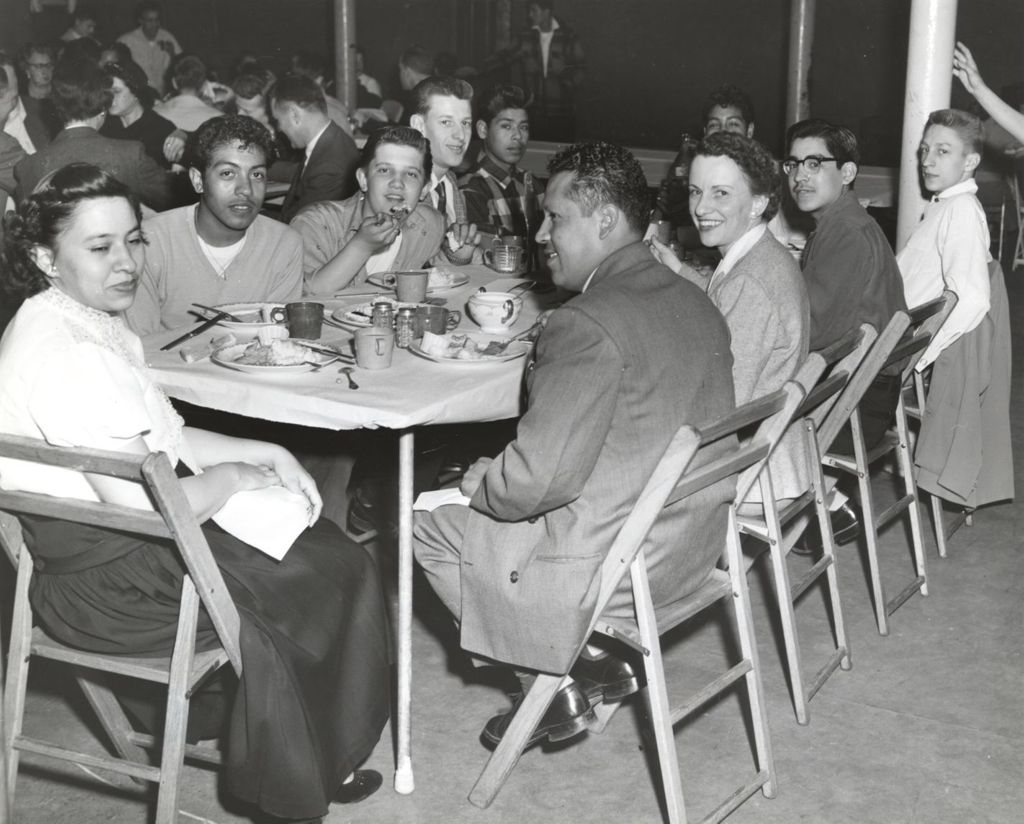 Miniature of Teenagers and adults at a dining event