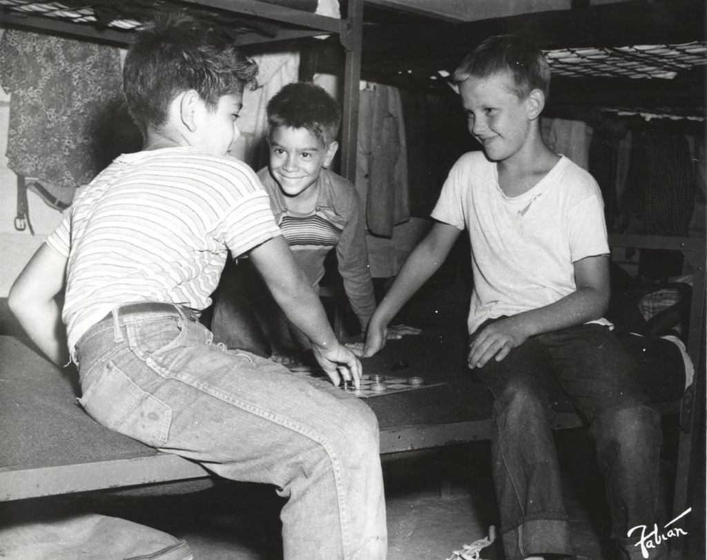 Miniature of Boys playing checkers at camp