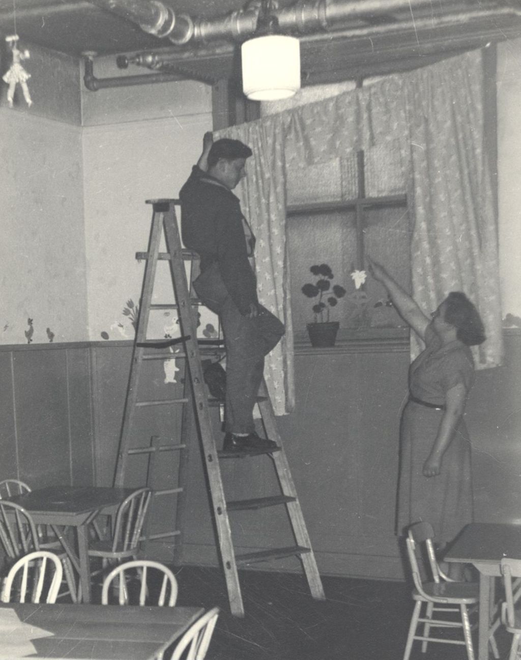 Hanging new drapes in the Play Club