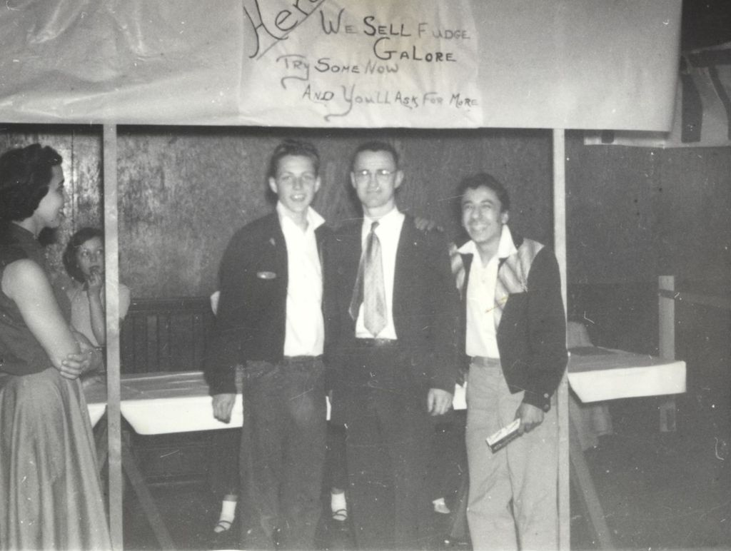 Men in front of a booth with fudge for sale