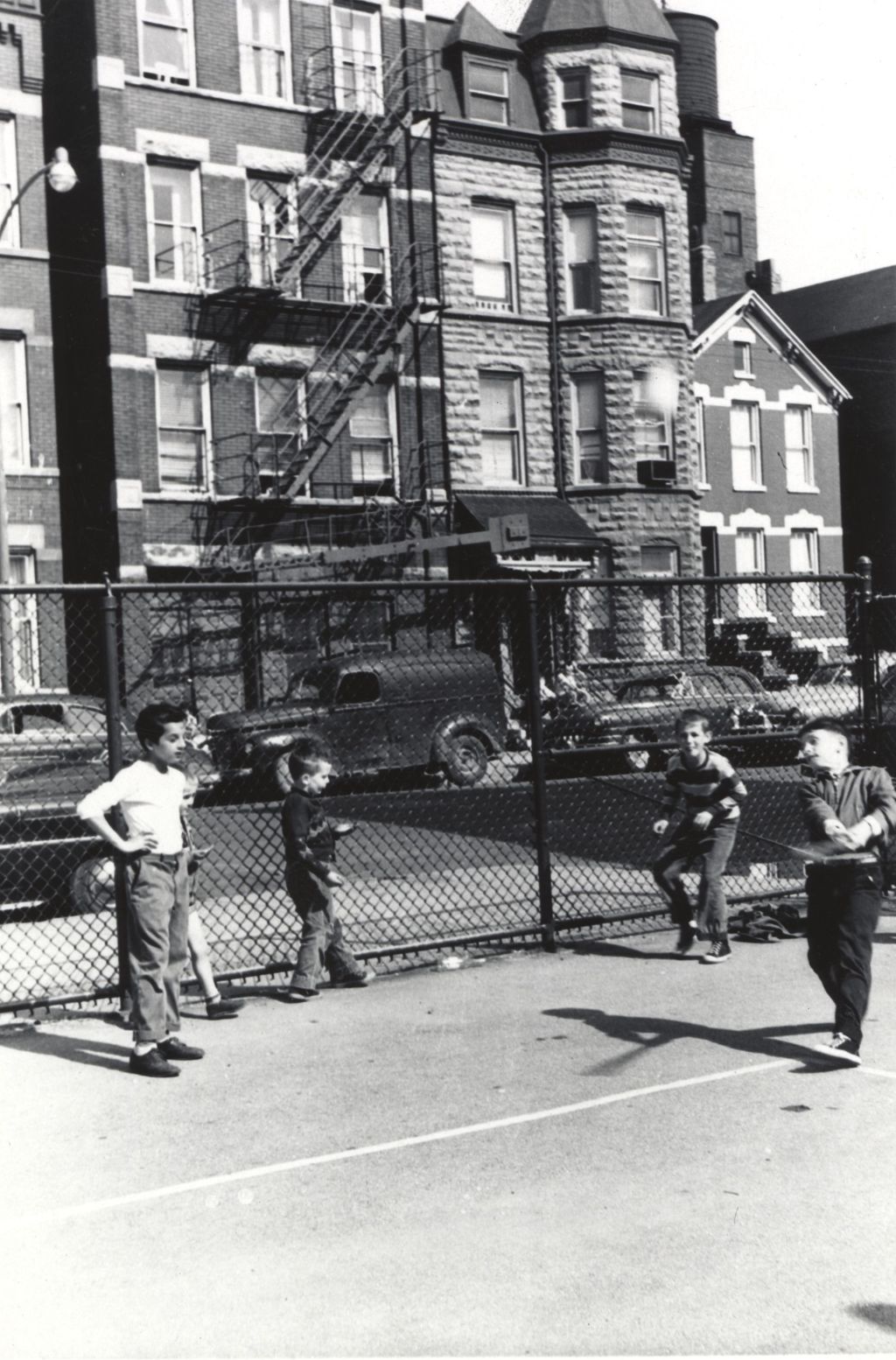 Boys playing baseball at Komensky School