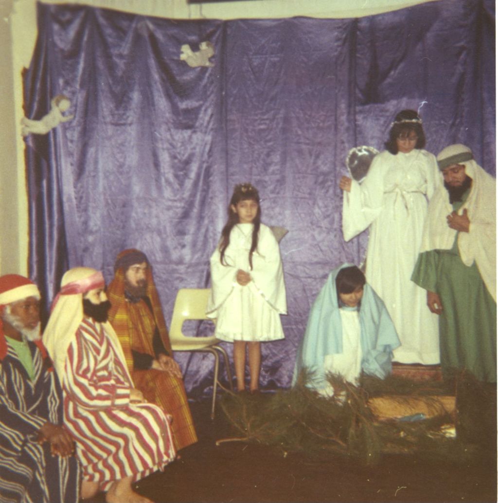 Miniature of Nativity scene presented by costumed children