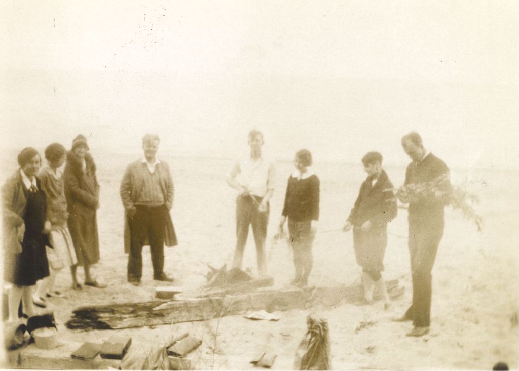 Group building a fire at the beach