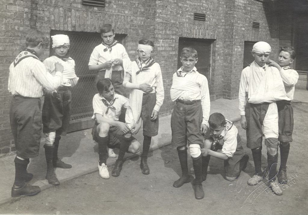 Boys in a first aid demostration