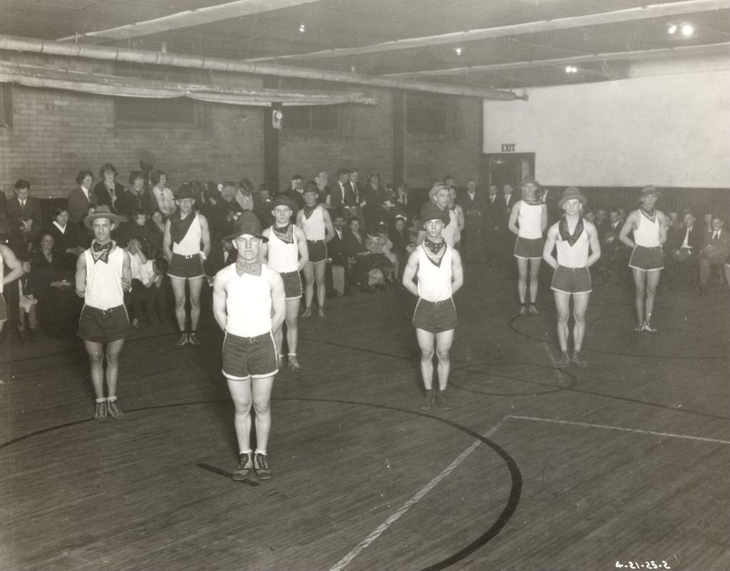 Boys athletic group performing in gymnasium