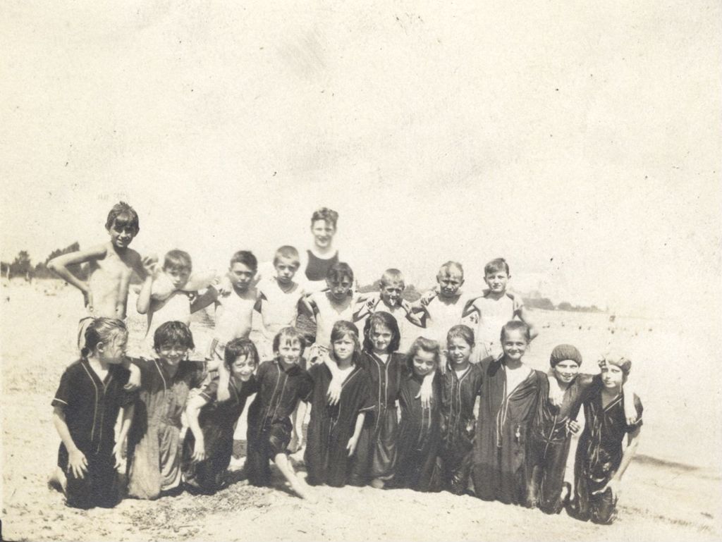 Children on a beach in swimming costumes