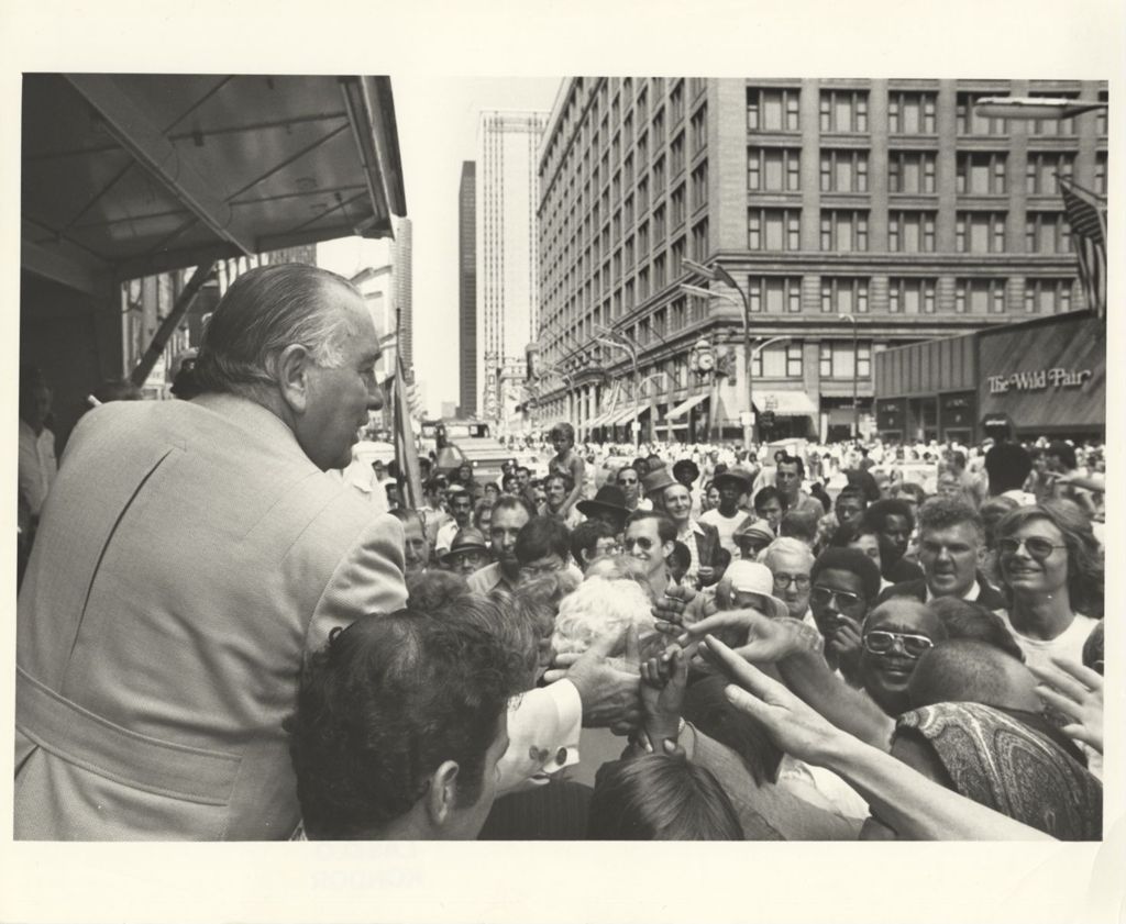 Parade Reviewing stand, Richard J. Daley shaking hands