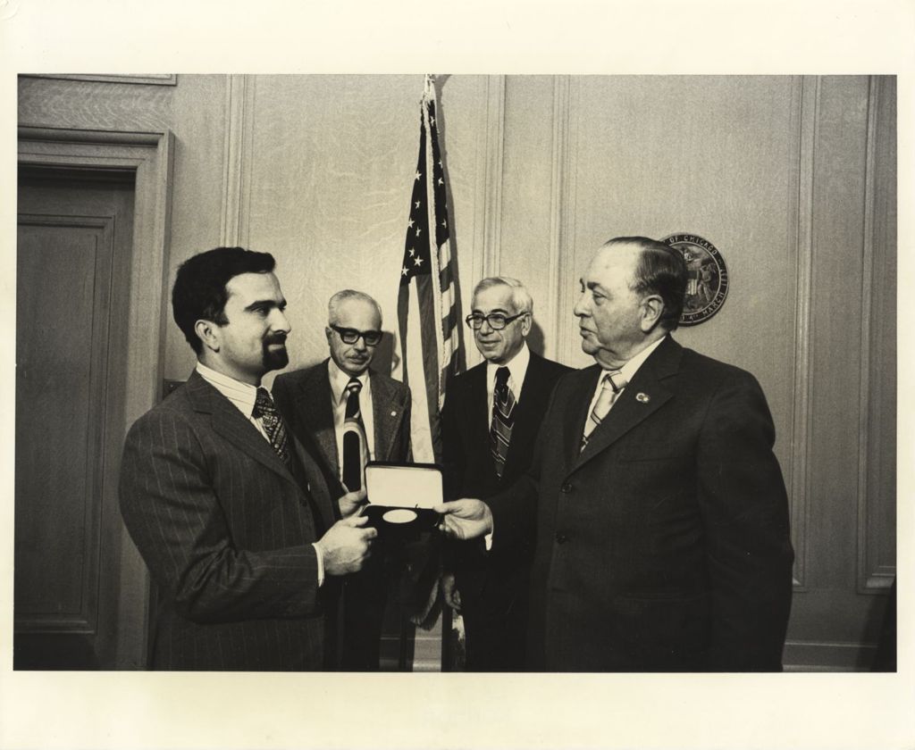 Richard J. Daley presents a Chicago medal