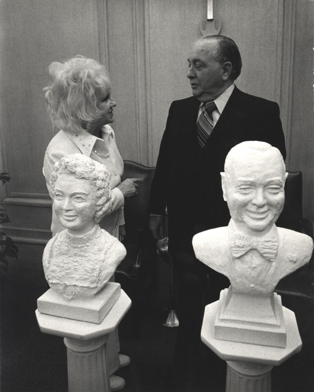 Sculptor Eleanor Root presenting Richard J. Daley with portrait busts