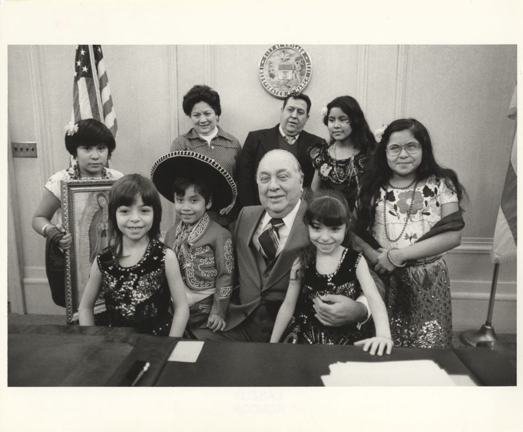 Miniature of Hispanic adults and children with Richard J. Daley in his office