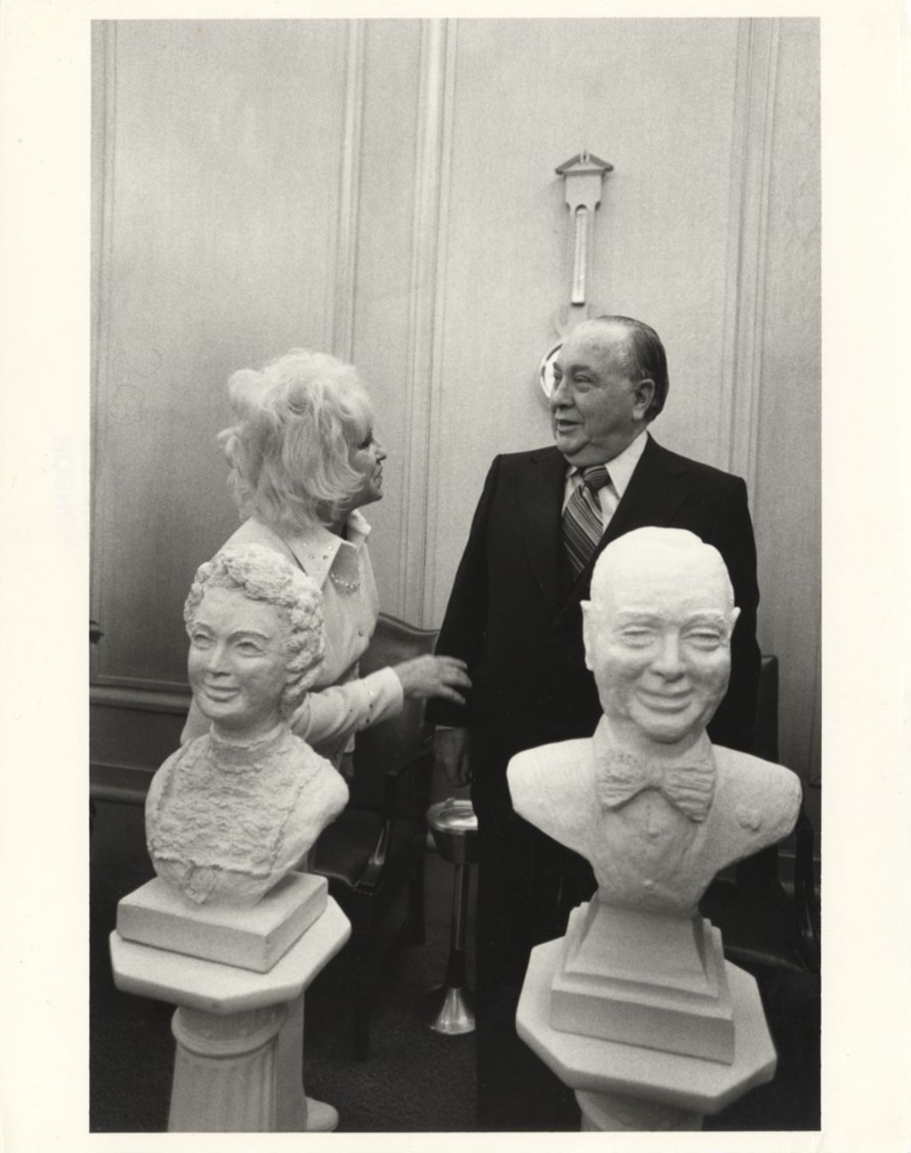 Miniature of Sculptor Eleanor Root presenting Richard J. Daley with portrait busts