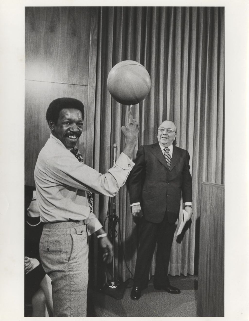 Miniature of Richard J. Daley with man spinning basketball at City Hall