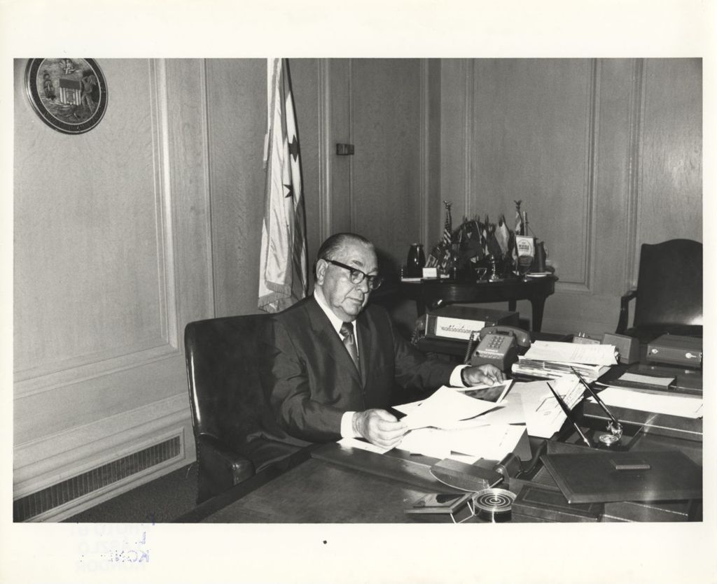 Miniature of Richard J. Daley working at his desk in City Hall
