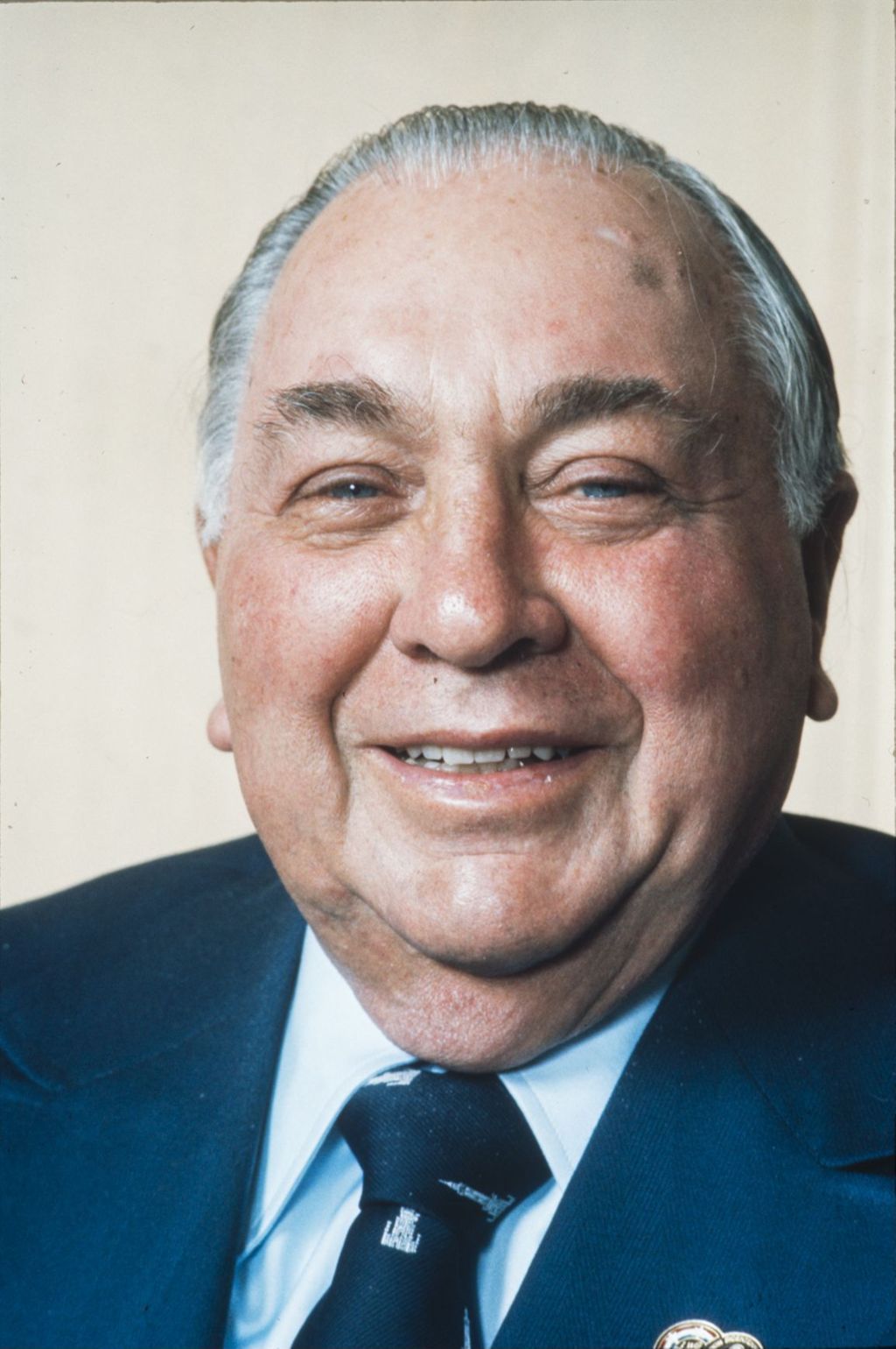 Portraits of Richard J. Daley in a dark blue suit and tie