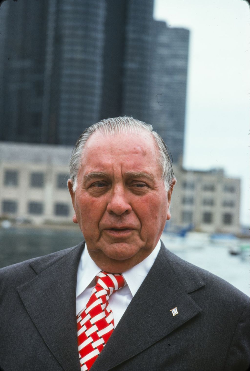 Miniature of Portraits of Richard J. Daley with buildings behind him
