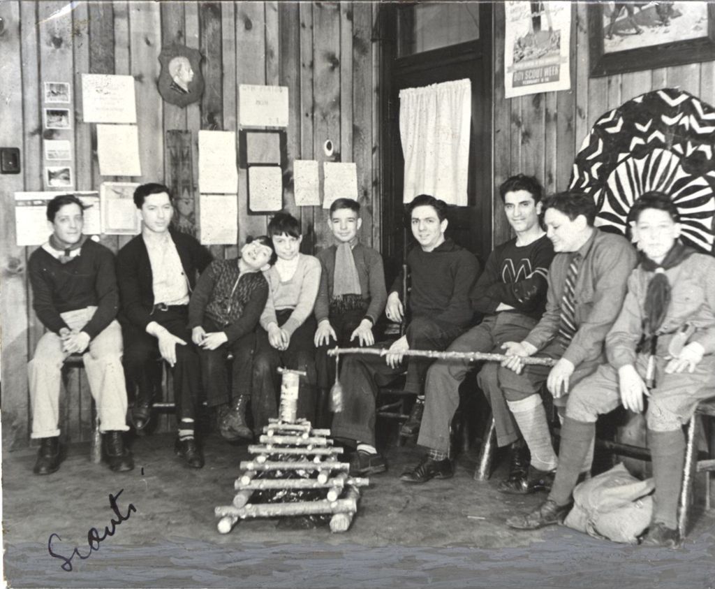 Boys and young men with a model of a campfire