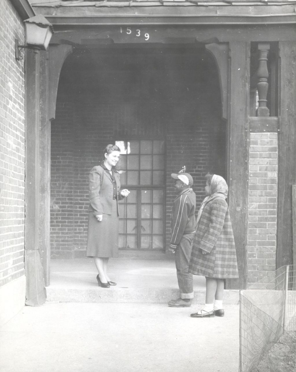 Miniature of Woman and children in front of Marcy Center building